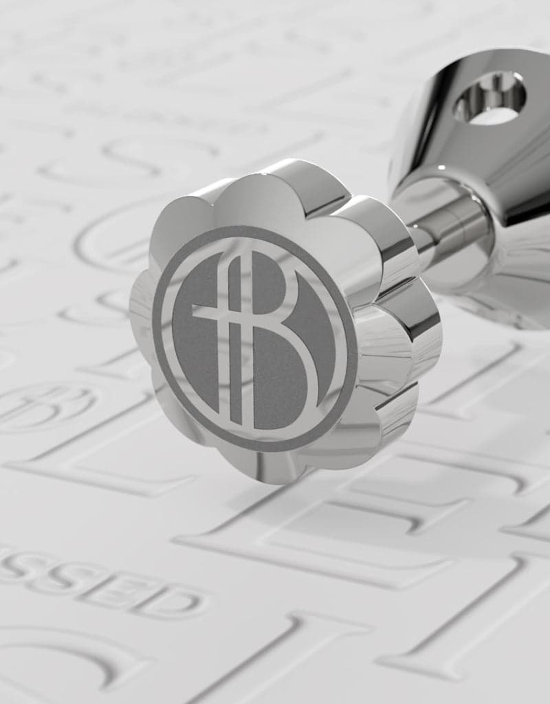 Titanium screw back engraved with the Blissed monogram